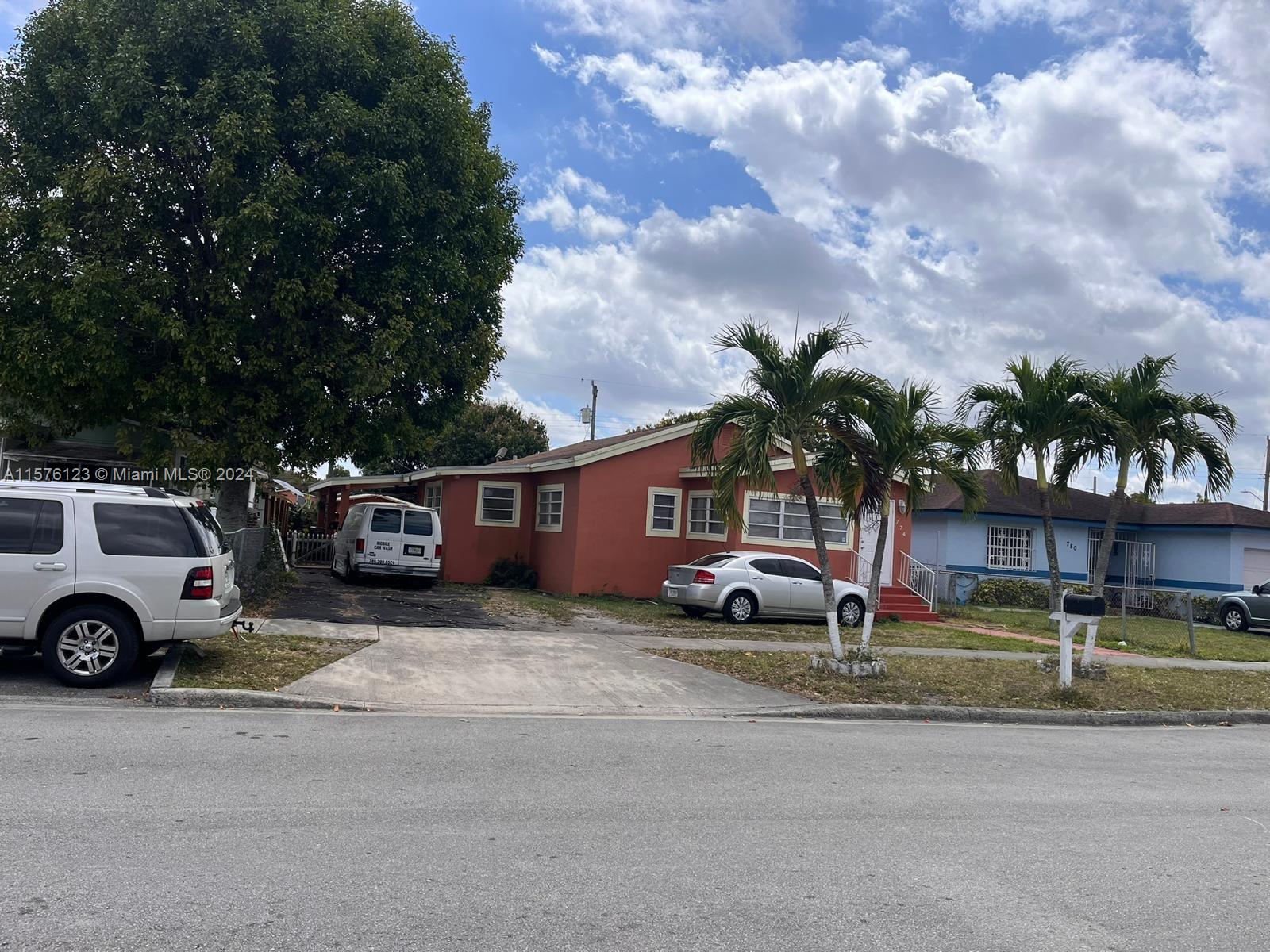 a view of a car park in front of house