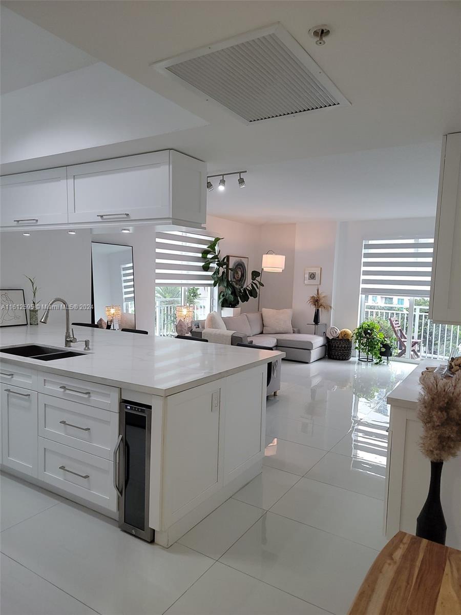 a kitchen with sink and cabinets