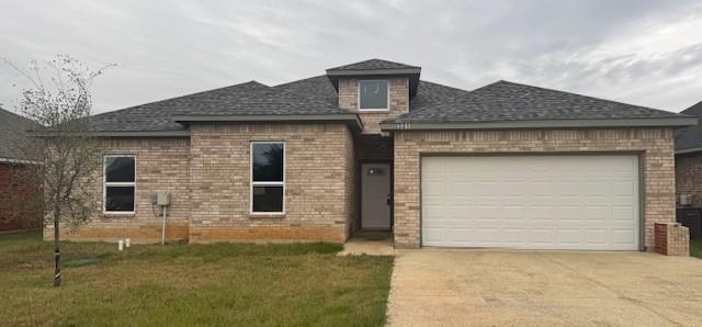 a front view of a house with garage