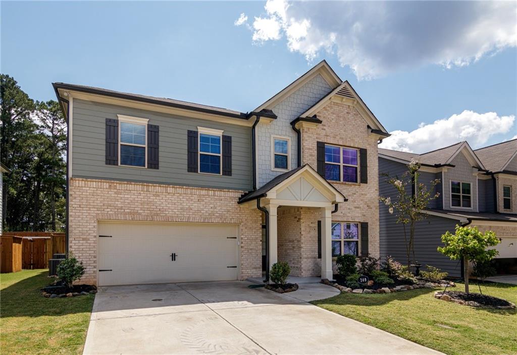 a front view of a house with yard