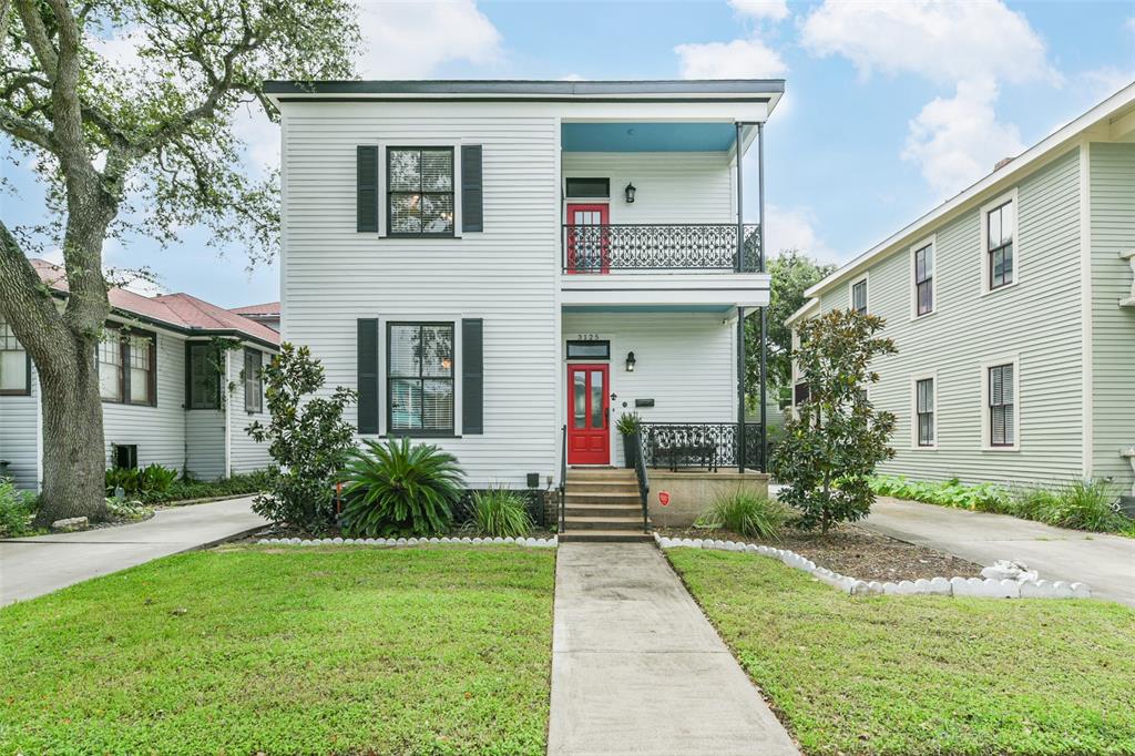 View of the front of the house with driveway to the left.