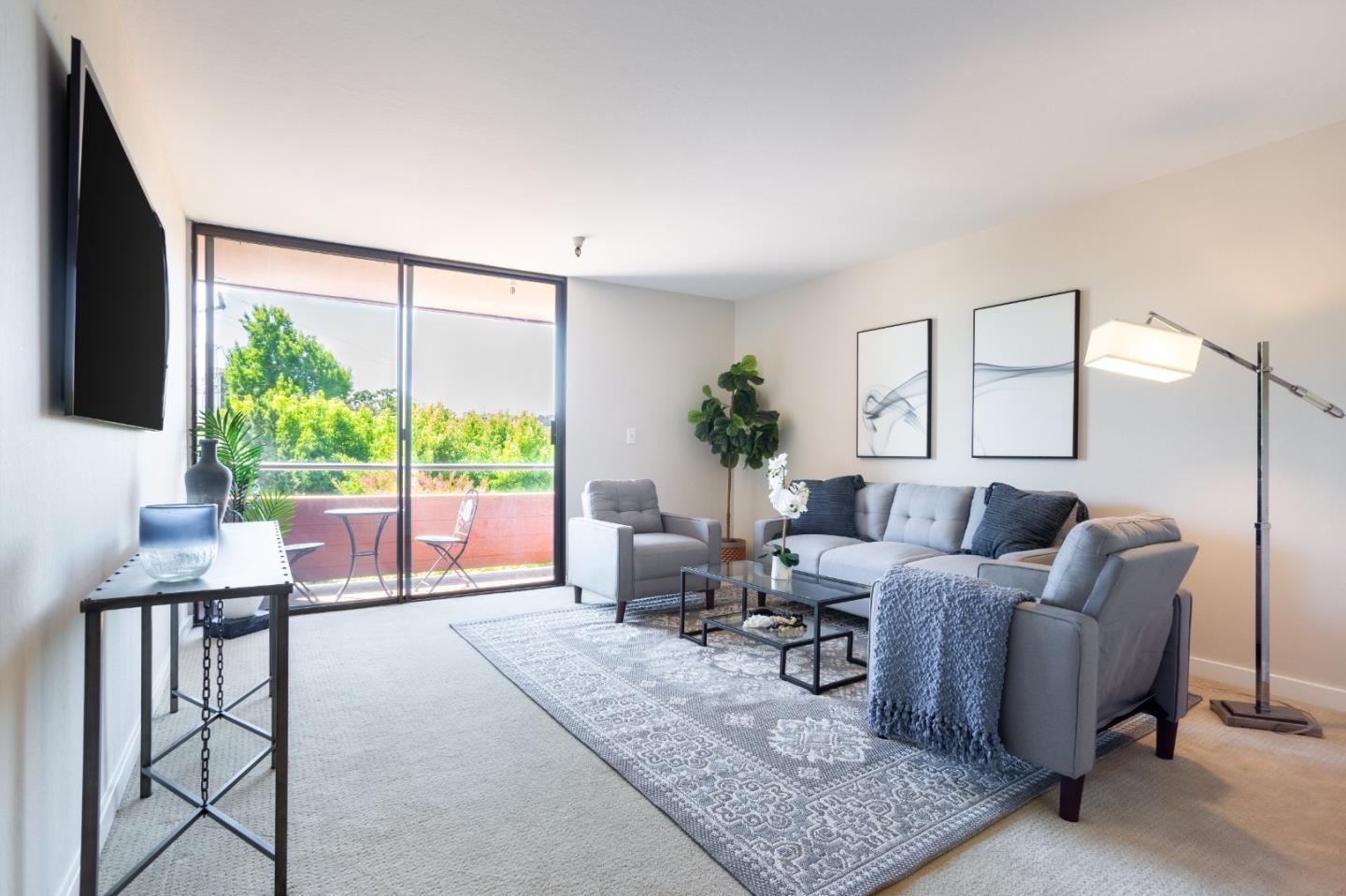 a living room with furniture and a large window