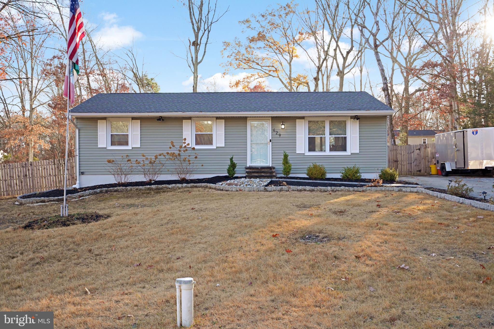 a front view of a house with yard