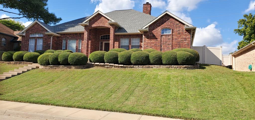 a front view of a house with a yard