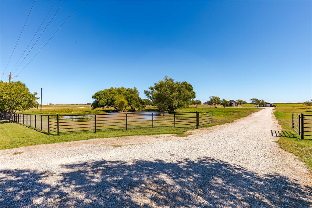 a view of a road with a yard