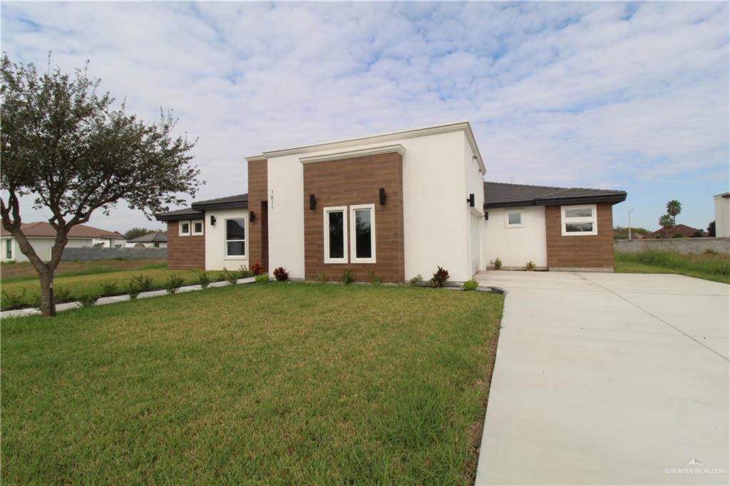 front view of a house with a yard