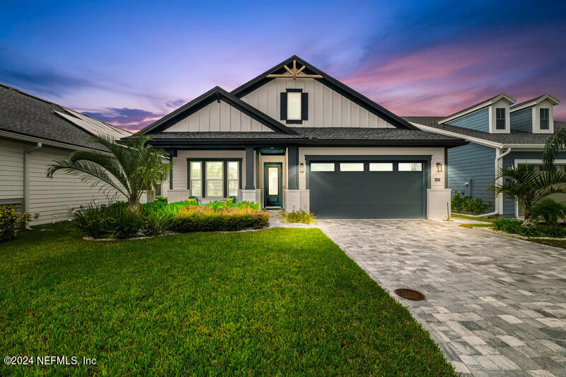 a front view of a house with a yard and porch