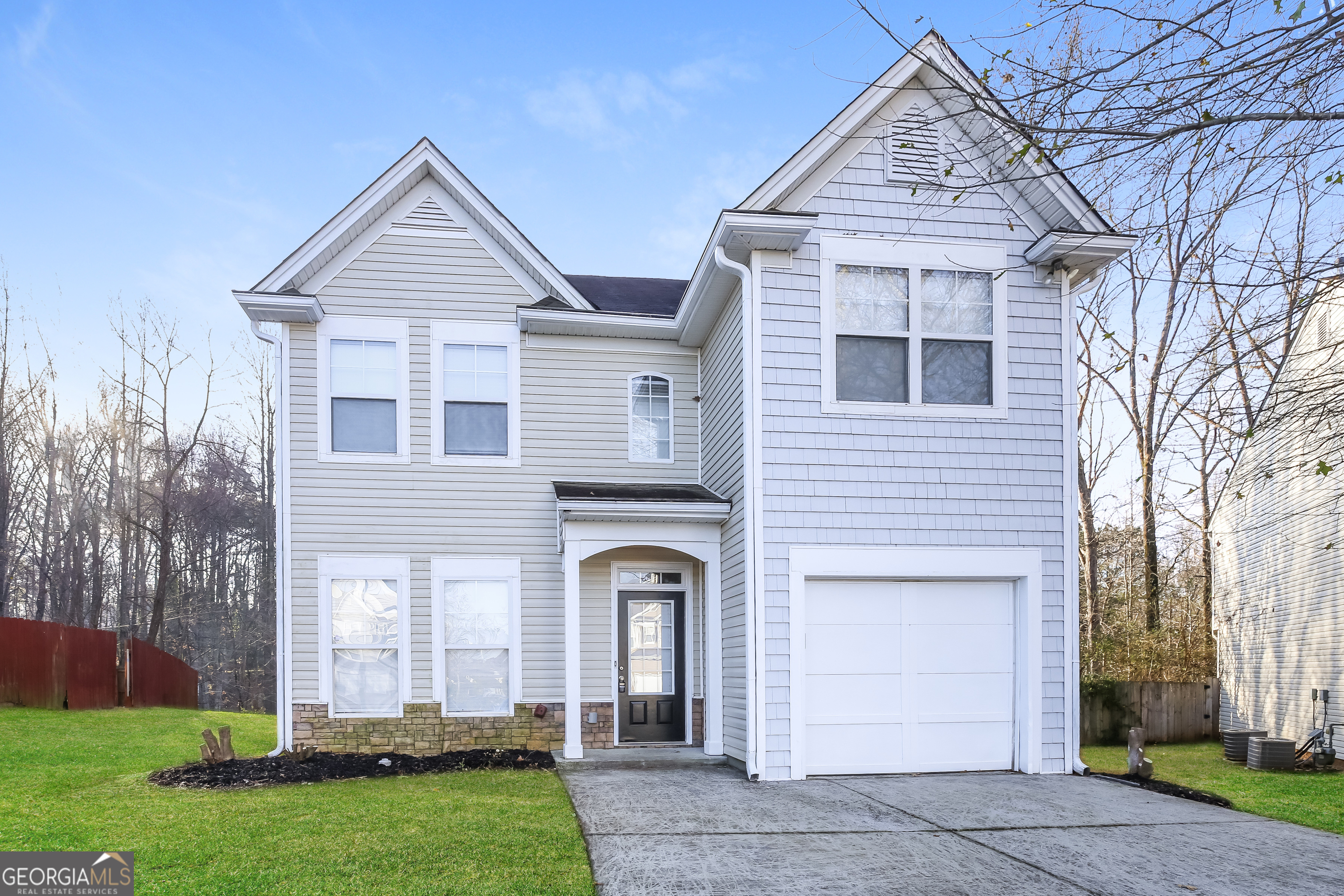 front view of a house with a yard