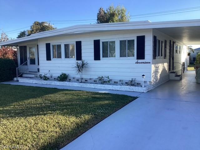 a view of a house with a yard