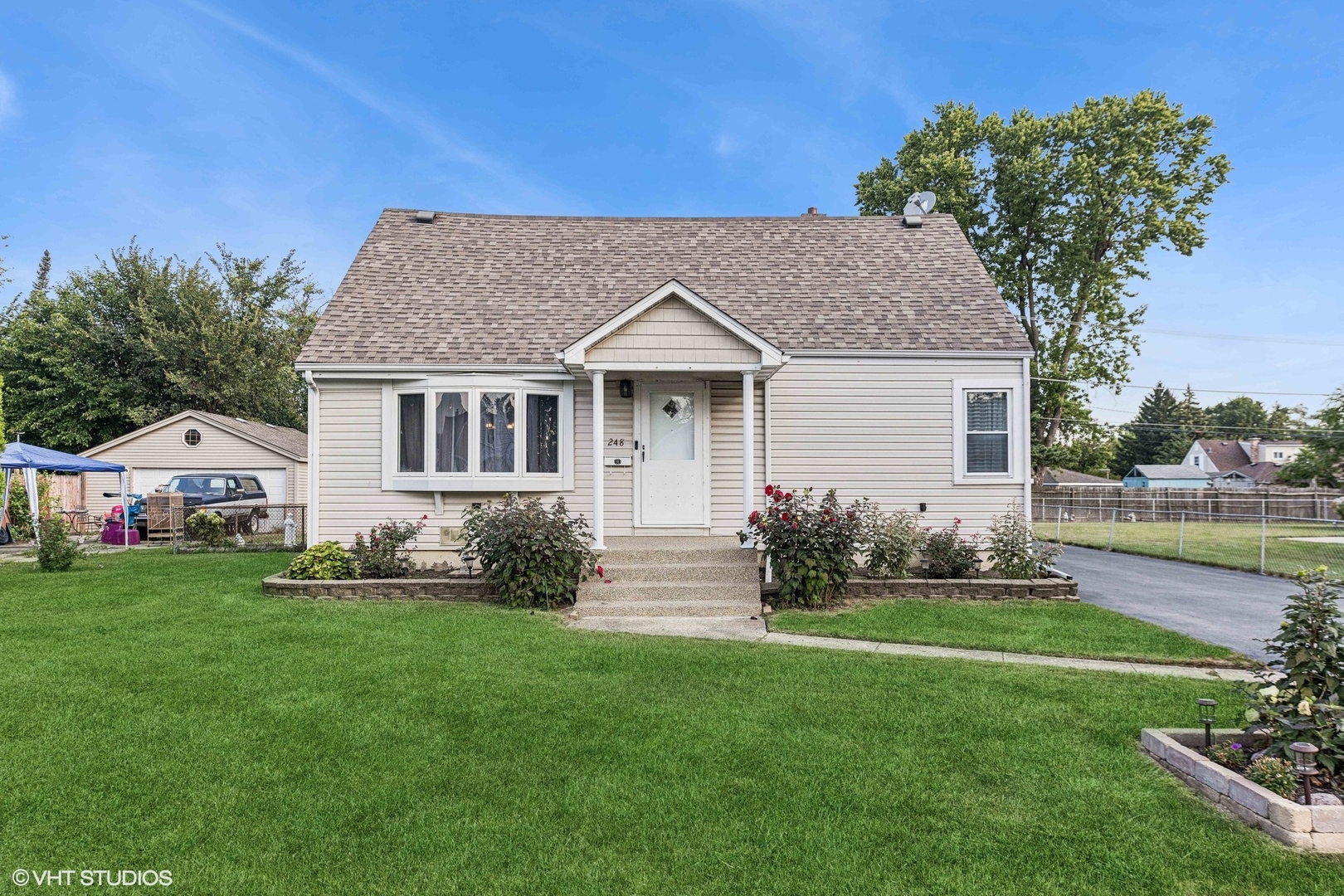 a front view of a house with garden