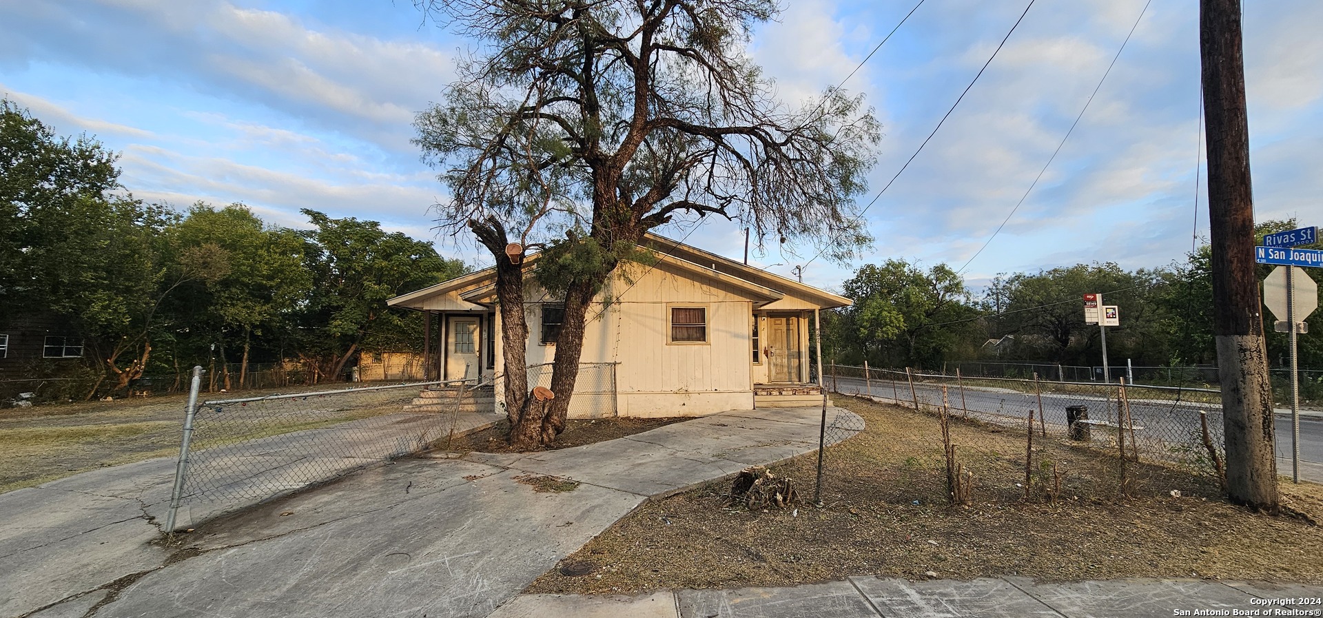 a house with trees in the background