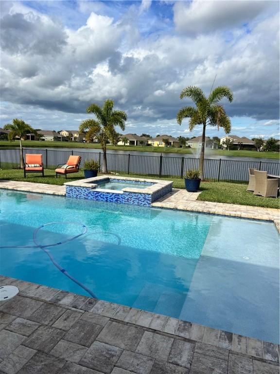 a view of a swimming pool with an outdoor seating