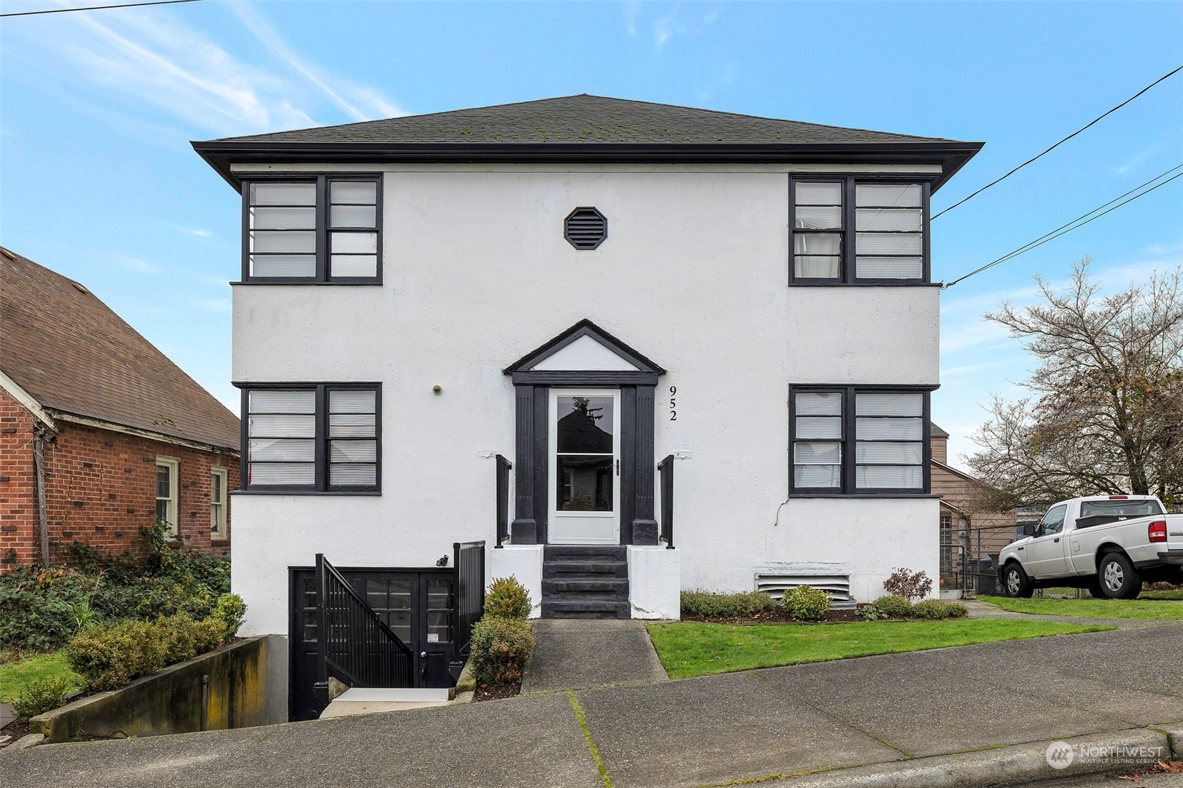 a front view of a house with a yard