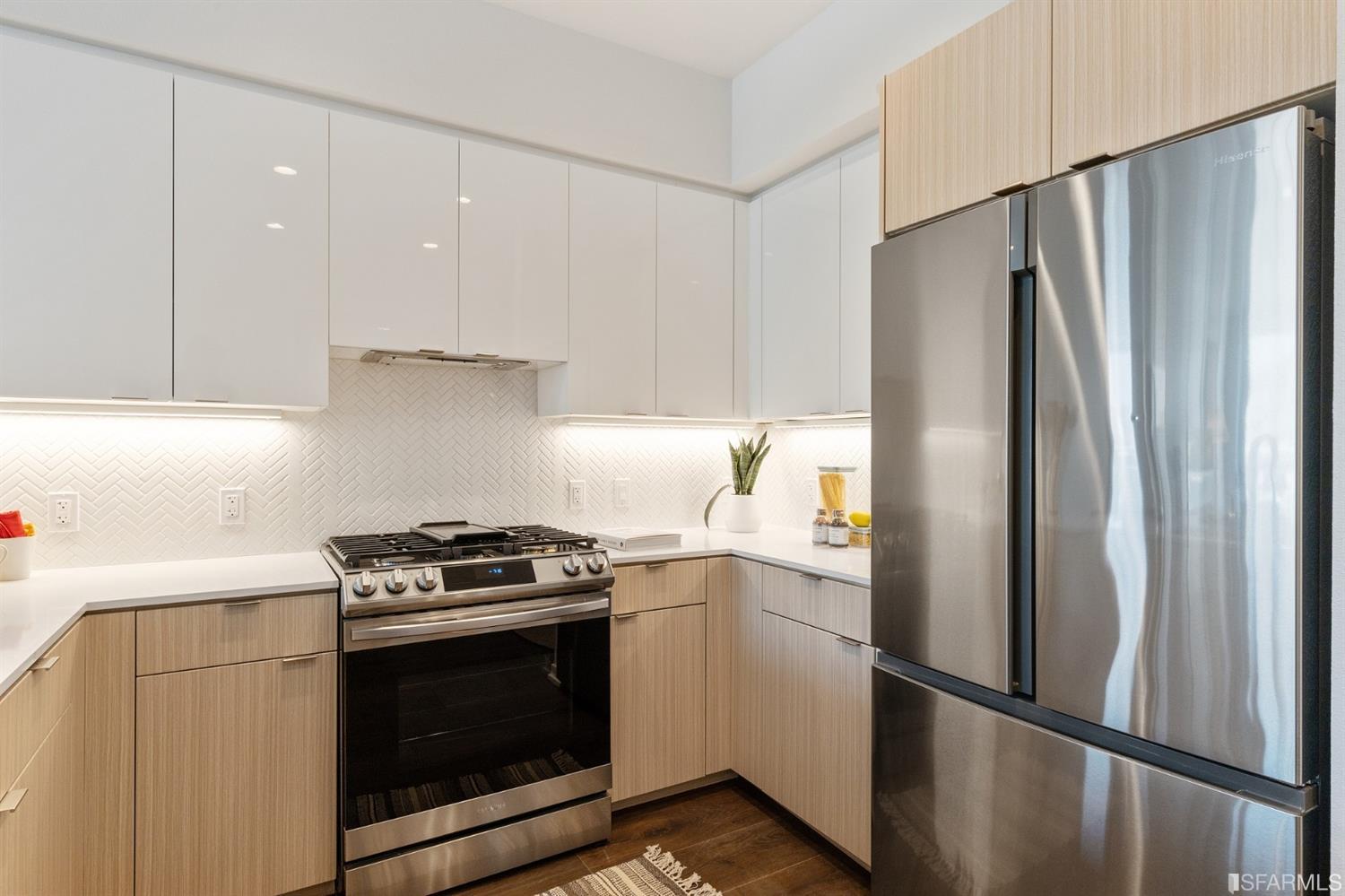 a kitchen with a stove microwave and refrigerator