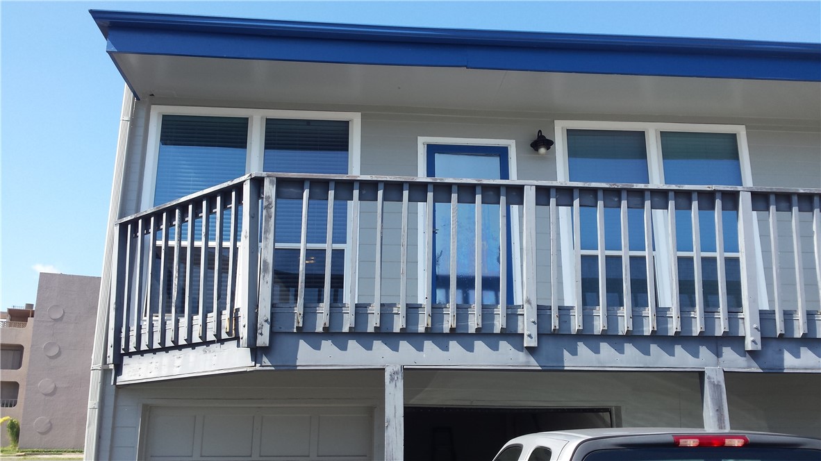 a view of a balcony with furniture