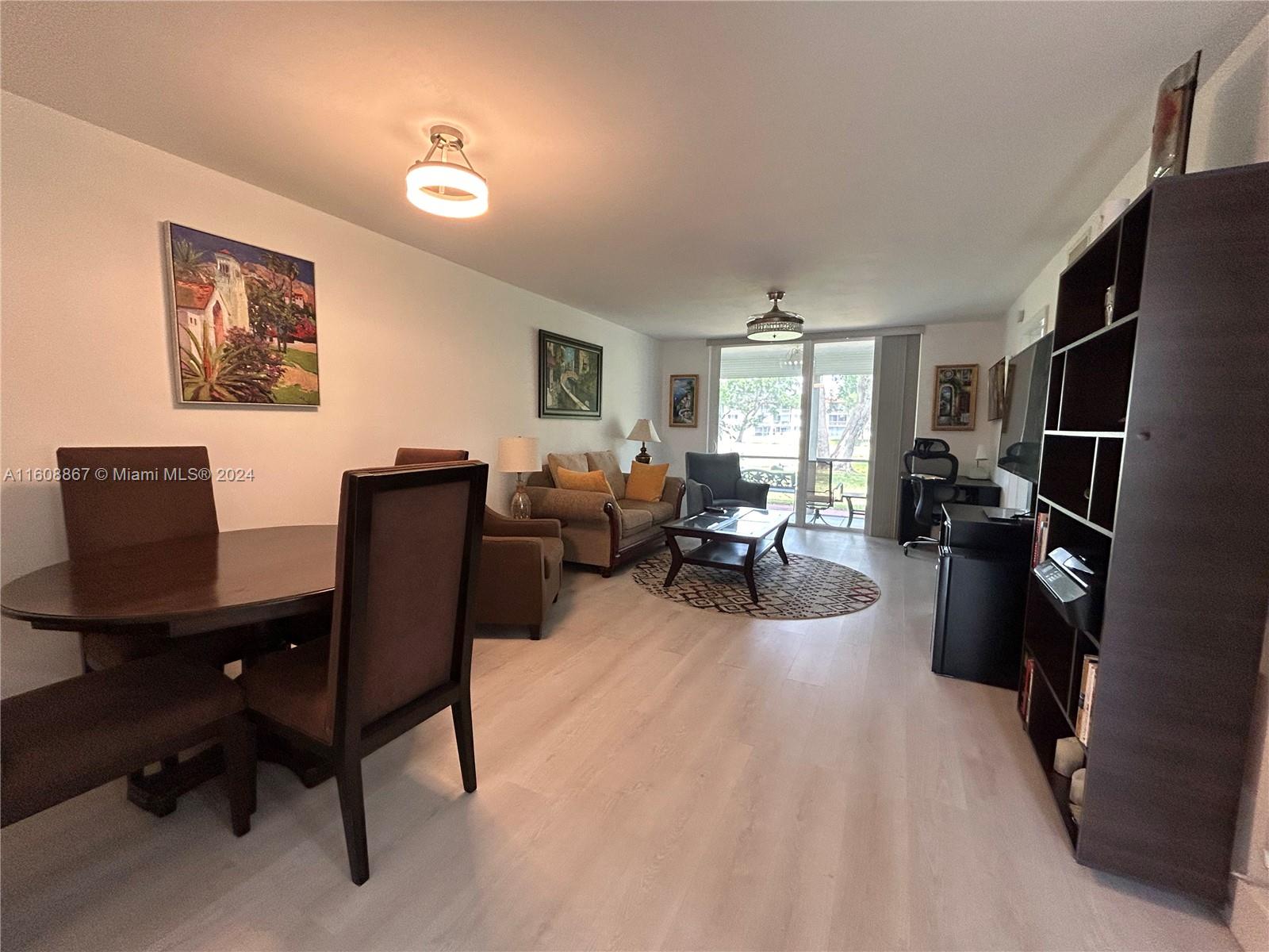 a view of a livingroom with workspace and a couch