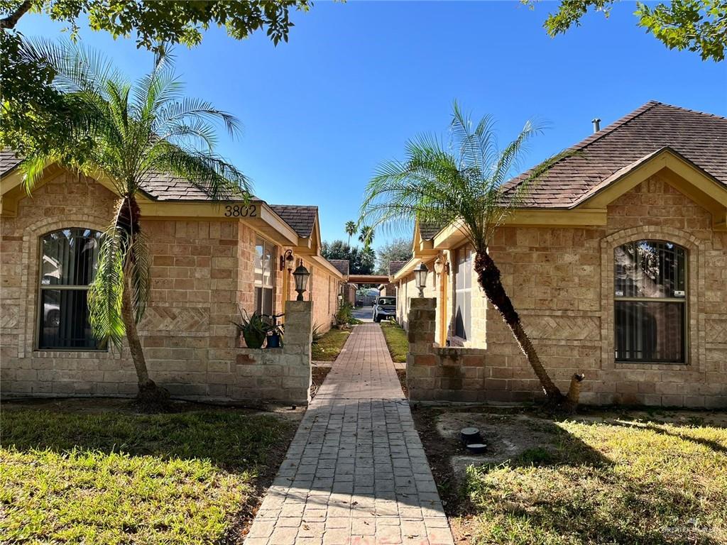 View of side of property featuring a yard