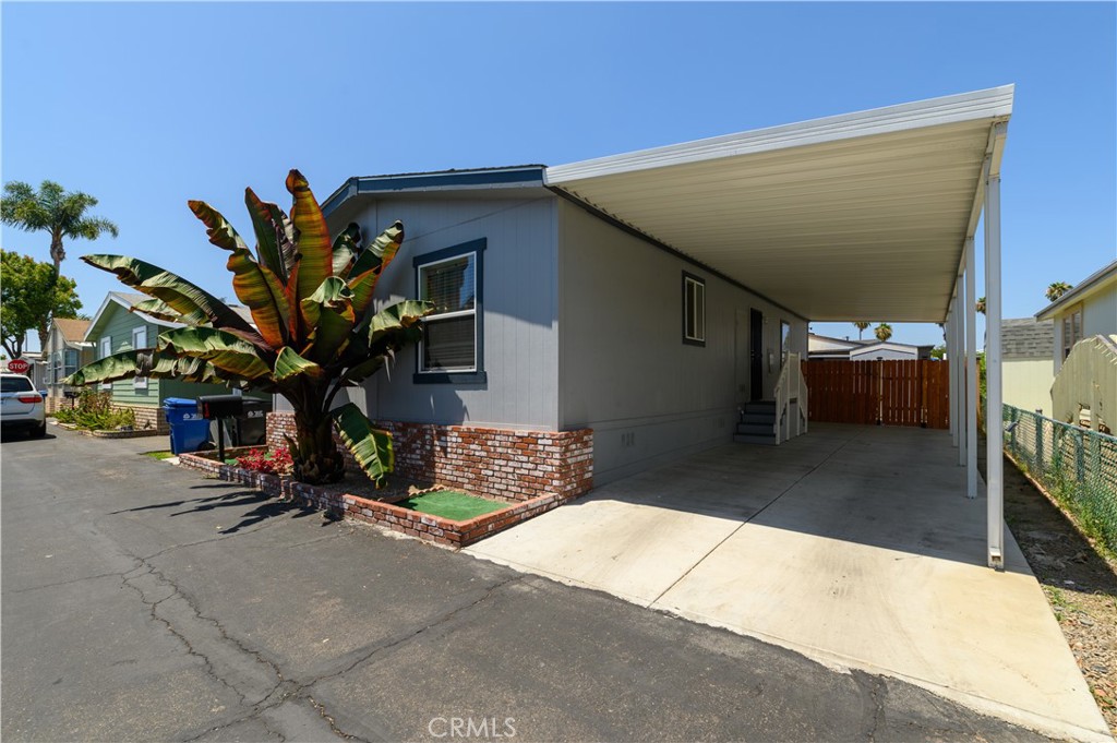 a view of a house with a backyard and a garage