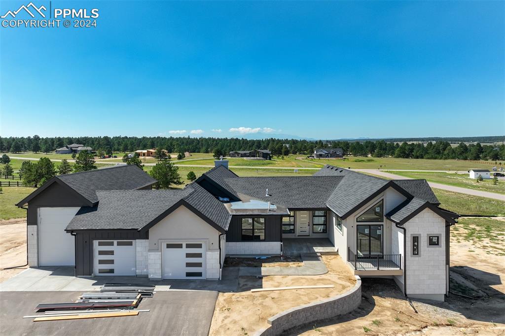 a aerial view of a house with a ocean view