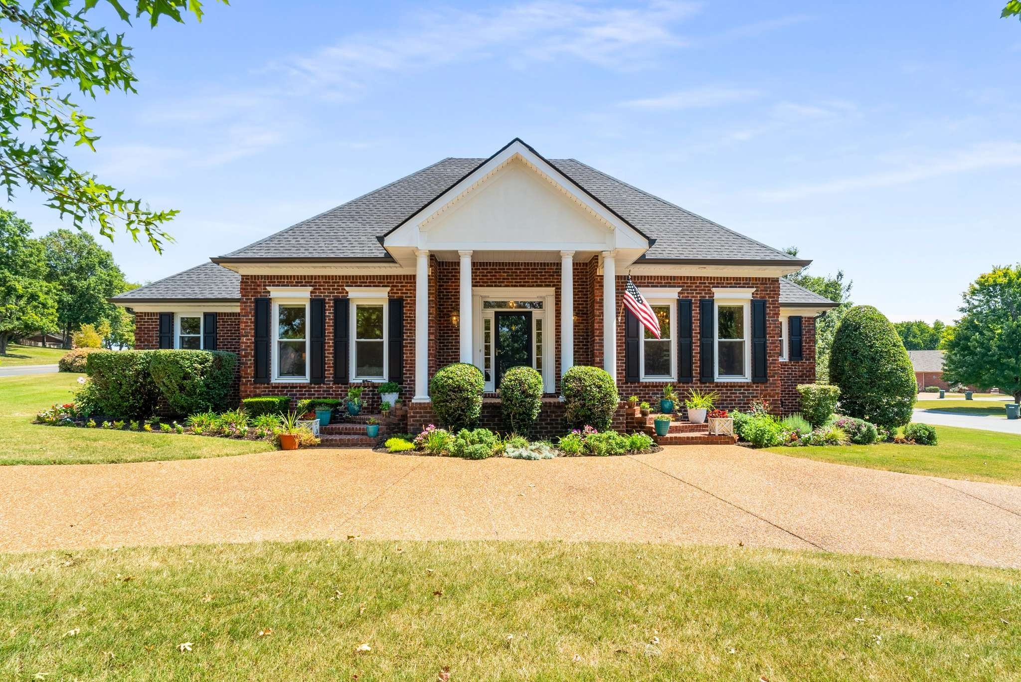 a front view of a house with a yard