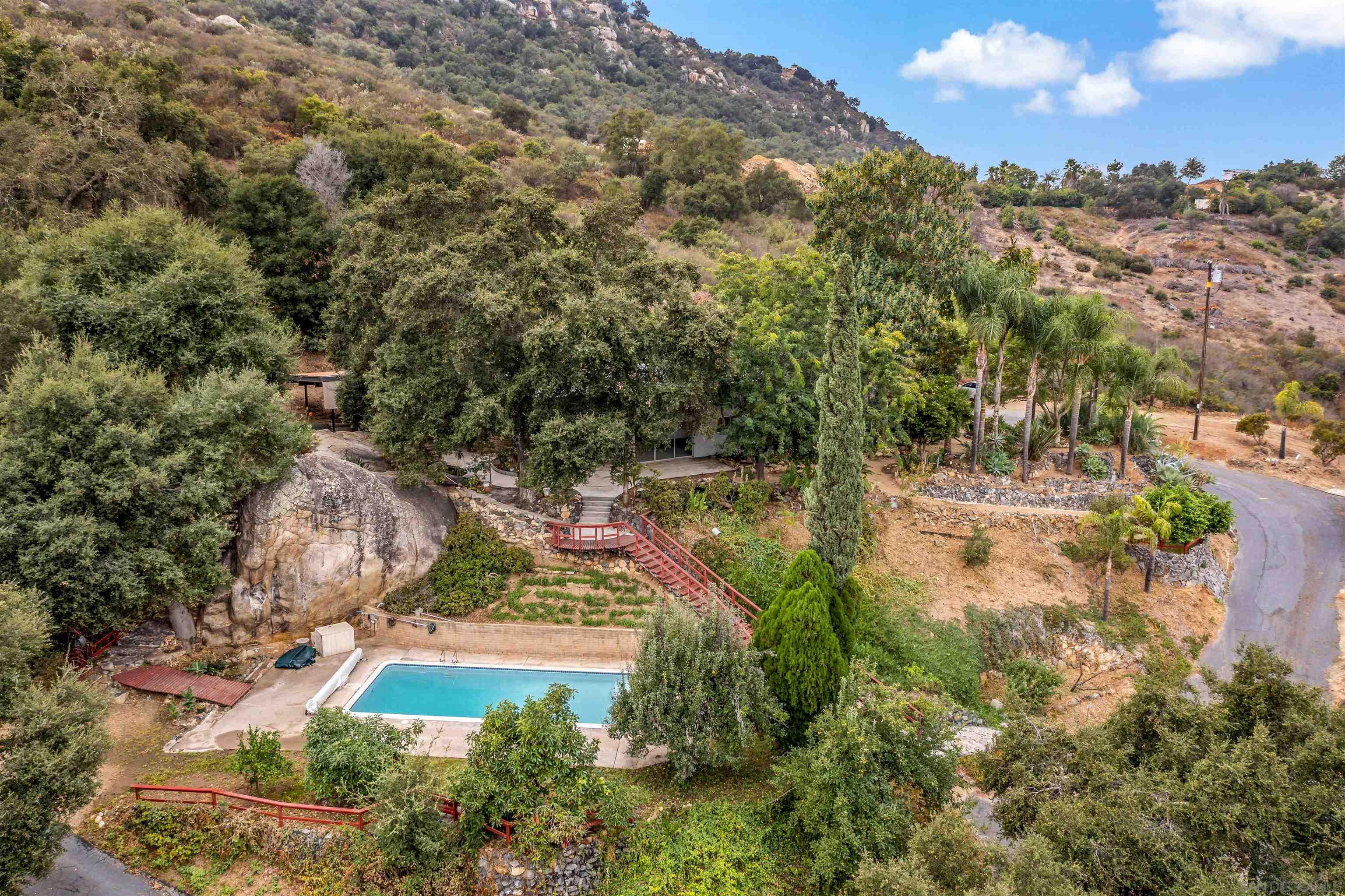 an aerial view of residential house with outdoor space