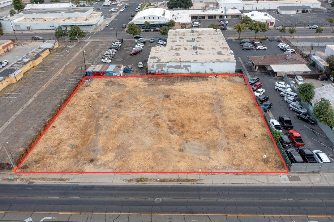 an aerial view of residential houses with yard