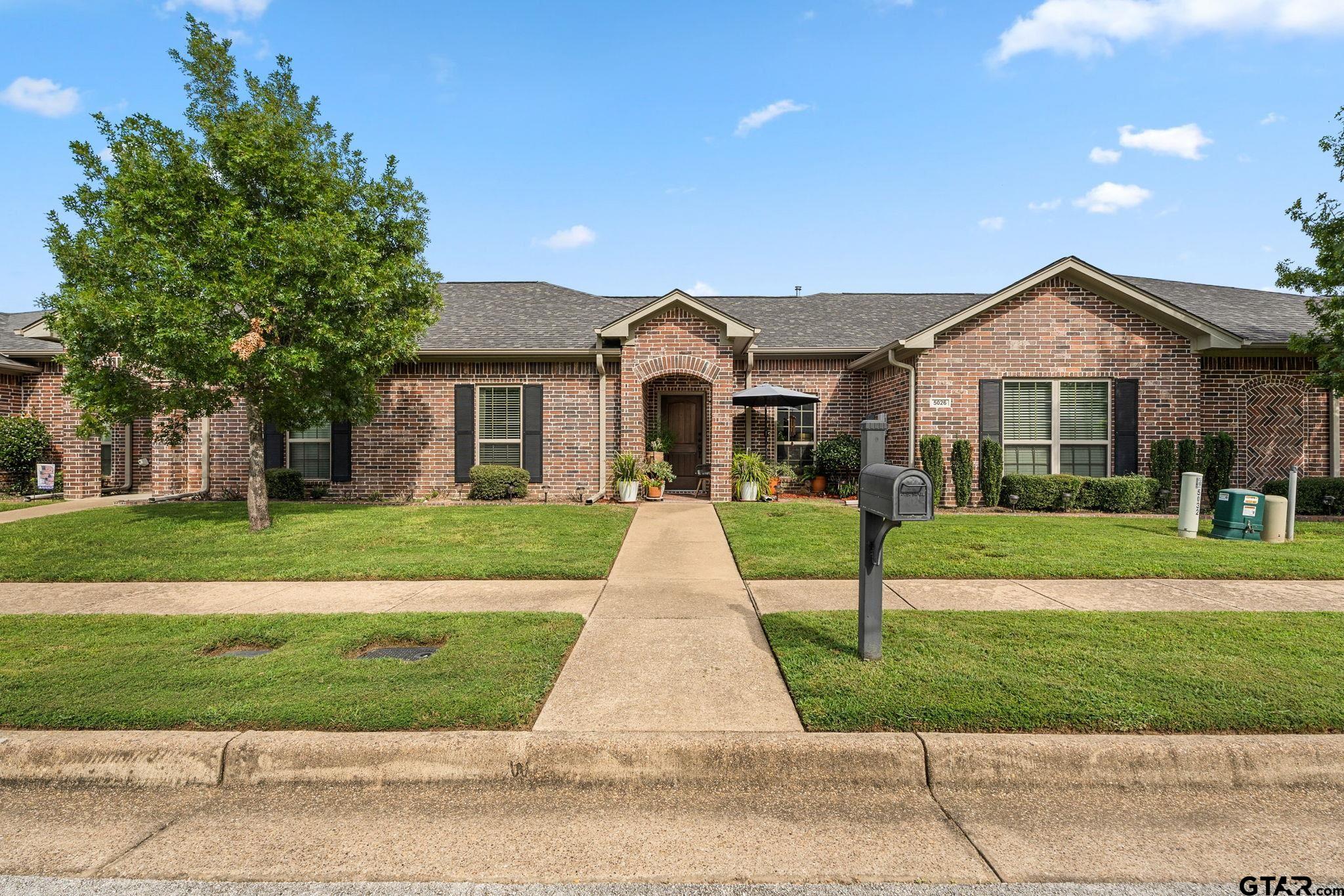 front view of a house and a yard