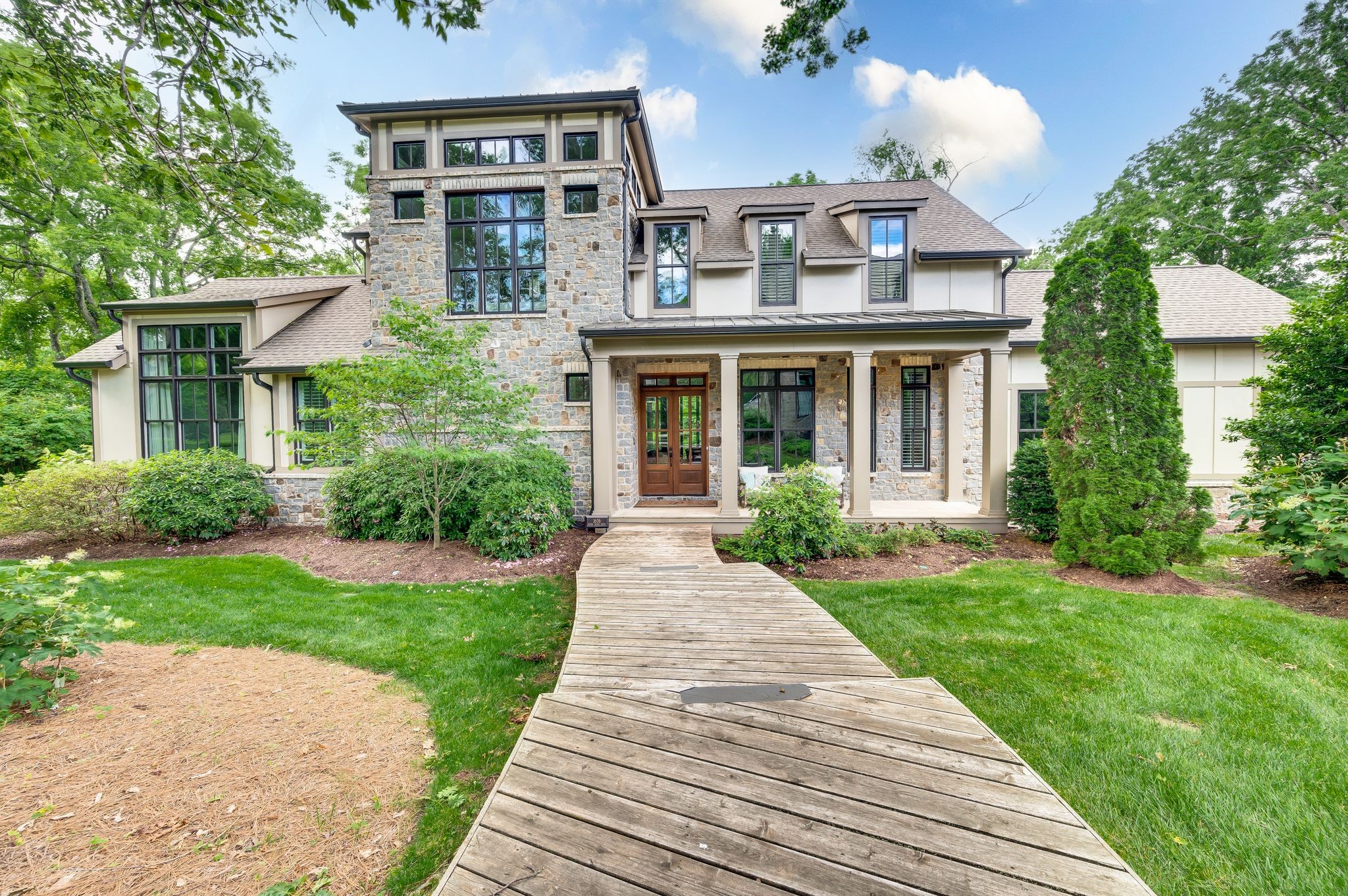 a front view of a house with garden