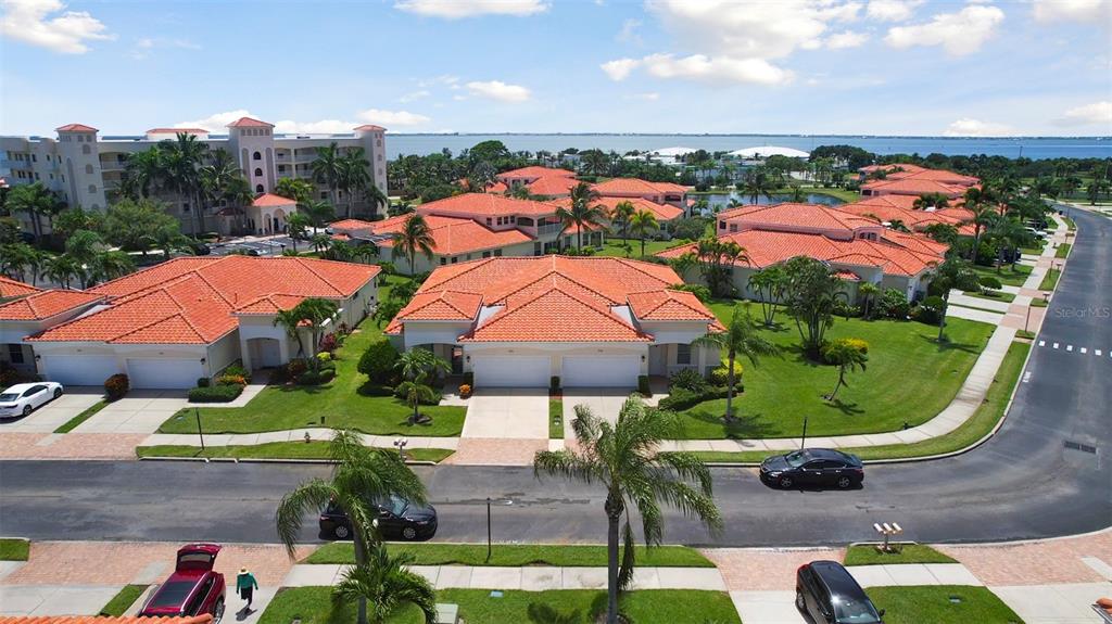 an aerial view of residential houses with outdoor space and swimming pool