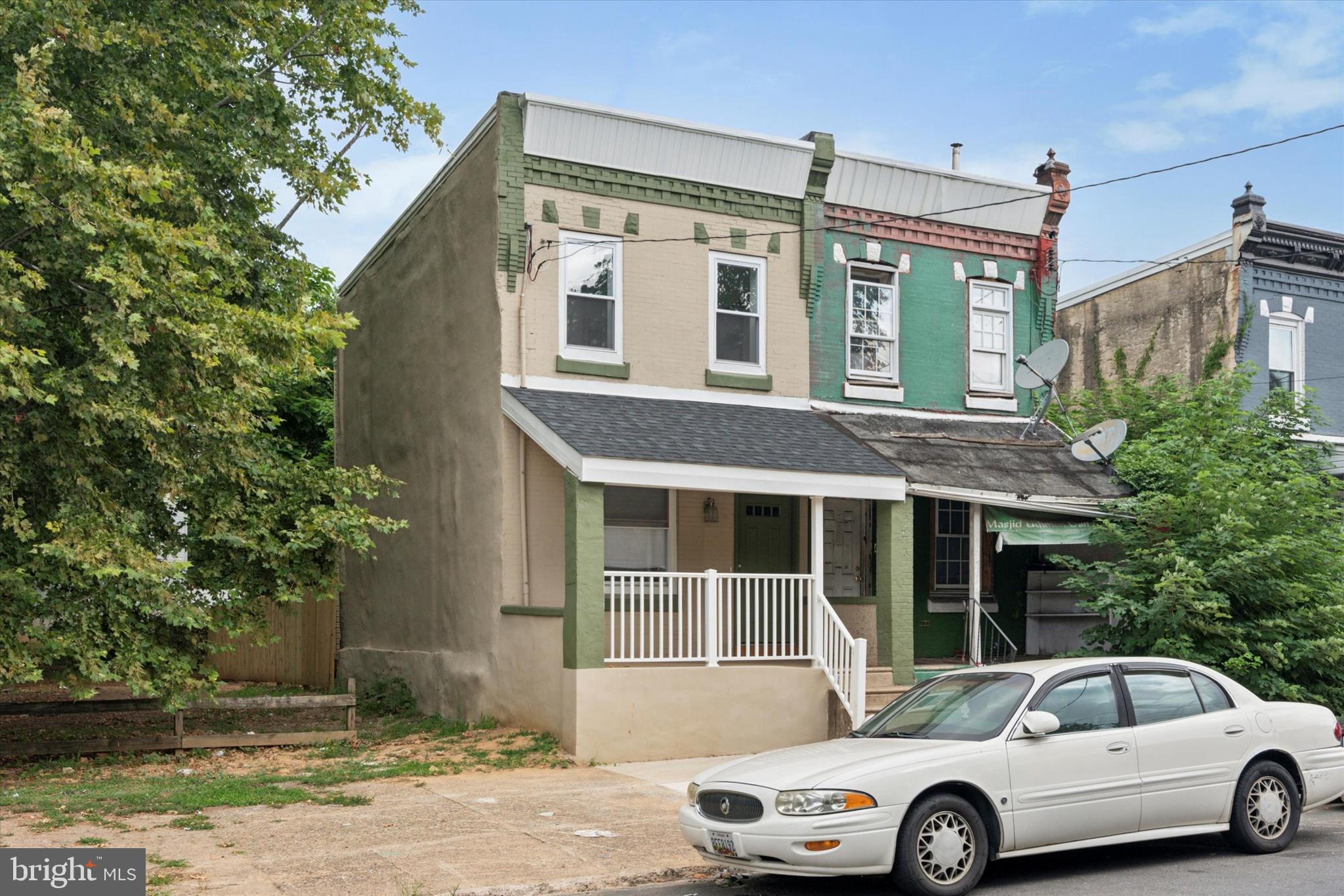 a front view of a house with parking