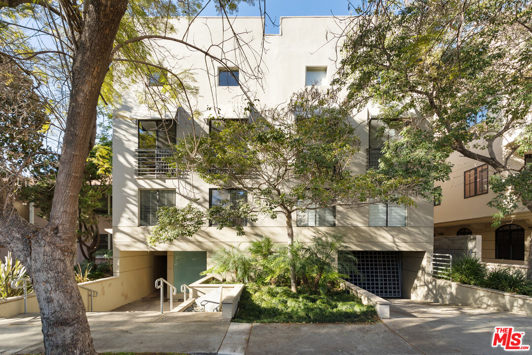 a view of a house with a tree