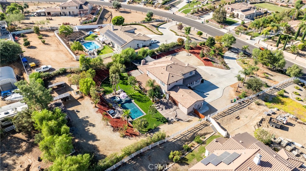 an aerial view of residential houses with outdoor space