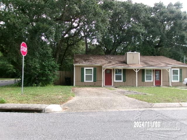 a front view of a house with yard