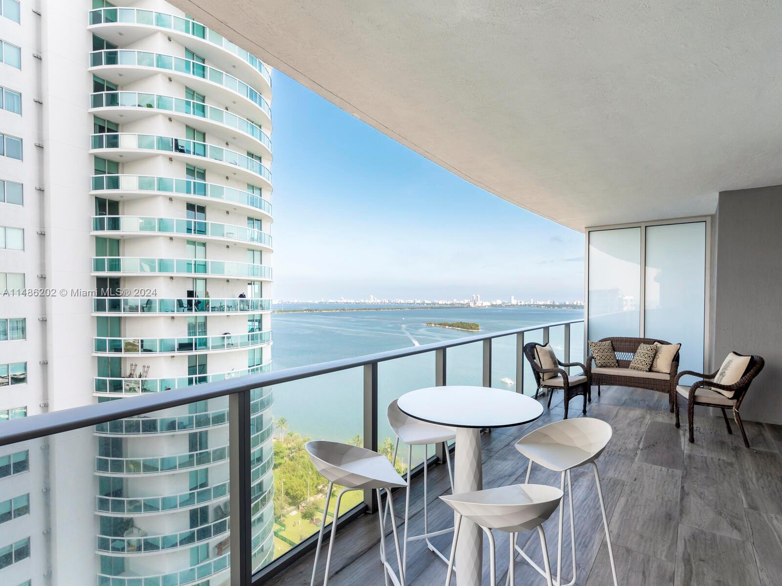 a view of a balcony with chairs