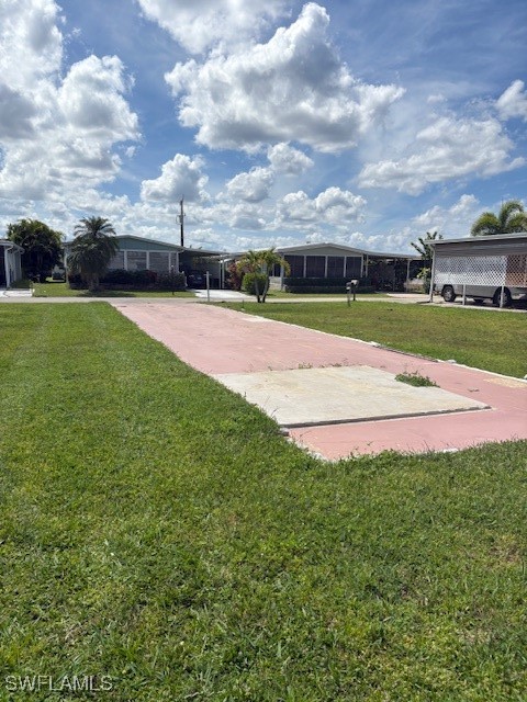 a view of green field with house in the background