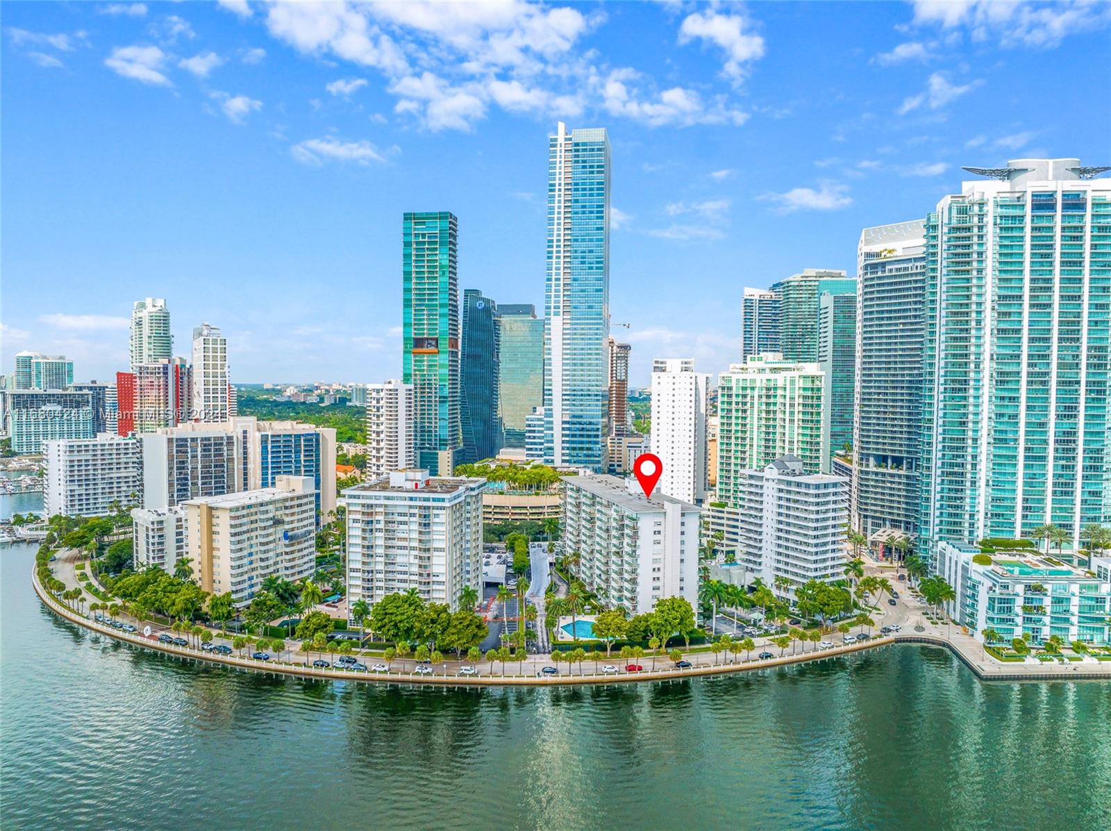 a view of a city with tall buildings and lake view