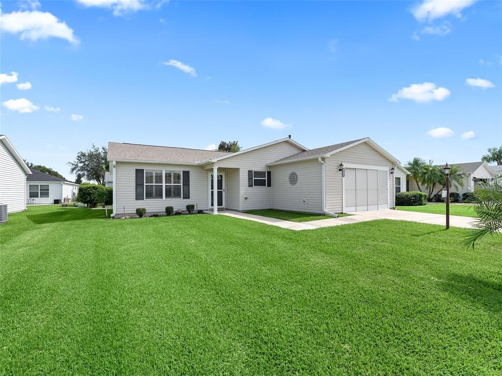 a view of a house with a backyard