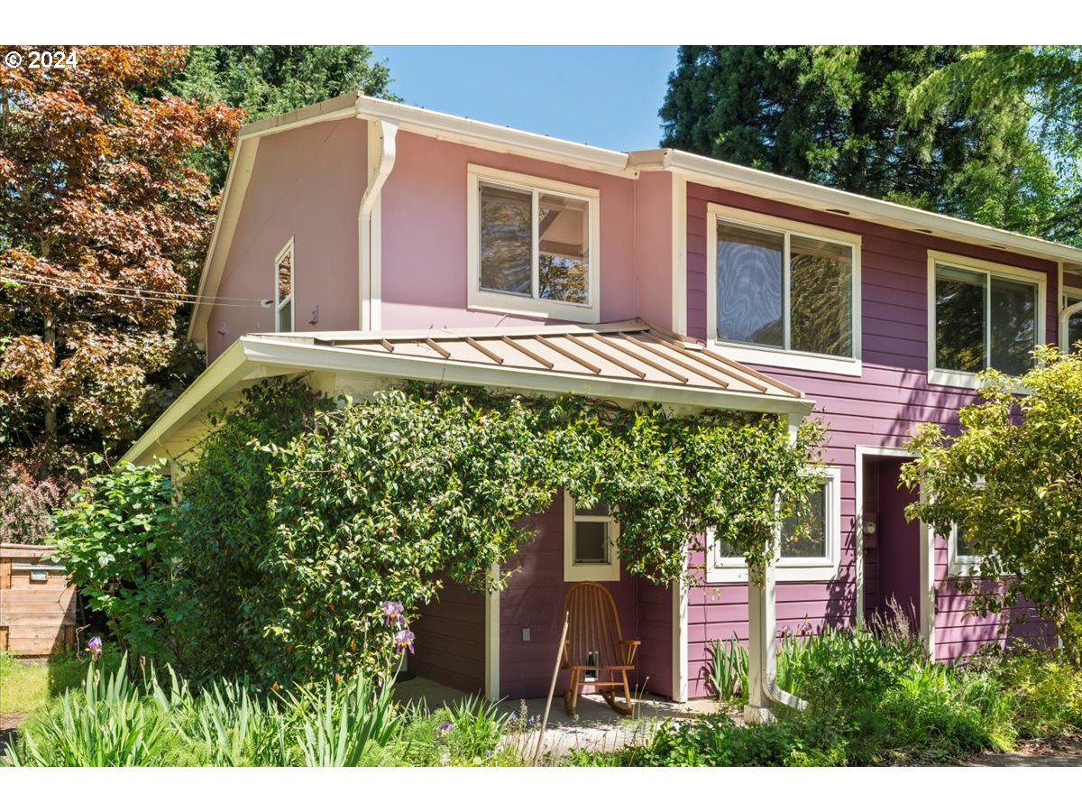 a house with a tree in front of it