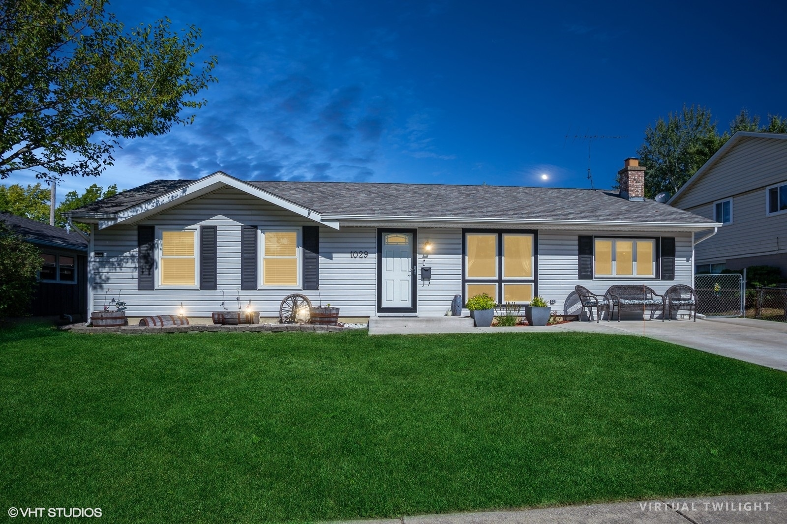 a front view of a house with swimming pool having outdoor seating