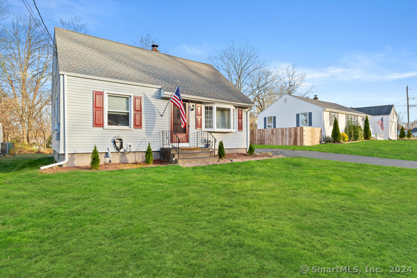 a front view of house with yard