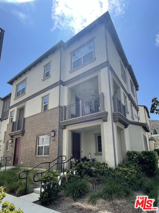 a front view of a multi story residential apartment building