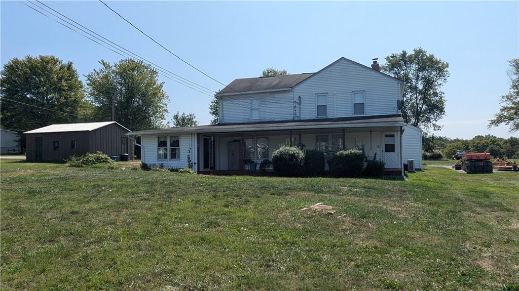 a view of a house with a back yard