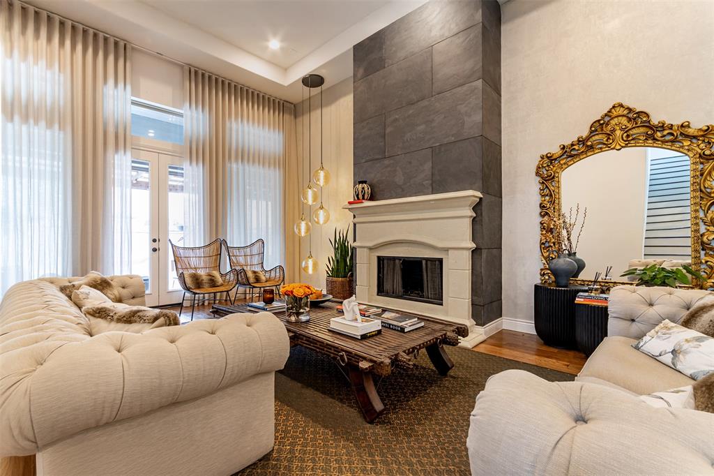 a living room with furniture fireplace and a fireplace