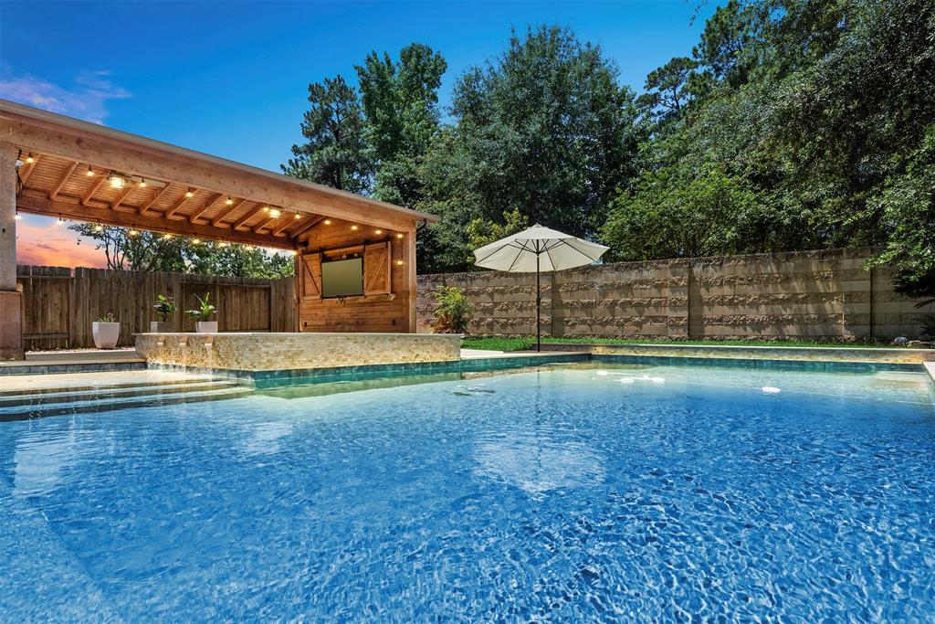 Stunning back yard oasis with sparkling pool, spa and custom-built cedar area for outdoor entertaining and family time! Backs to a wooded area with no back neighbors.