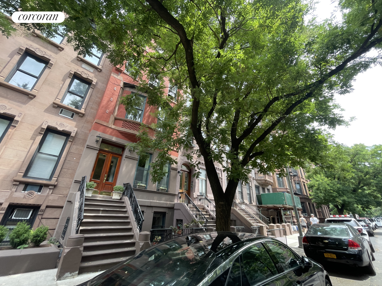 a view of street with parked cars