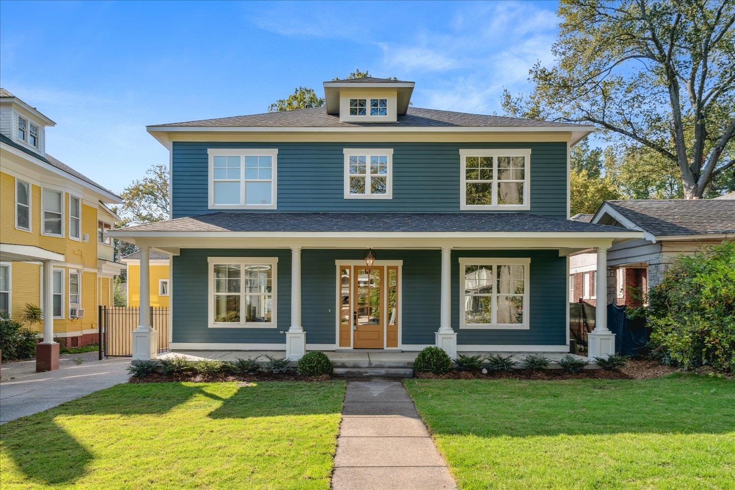 a front view of a house with a yard