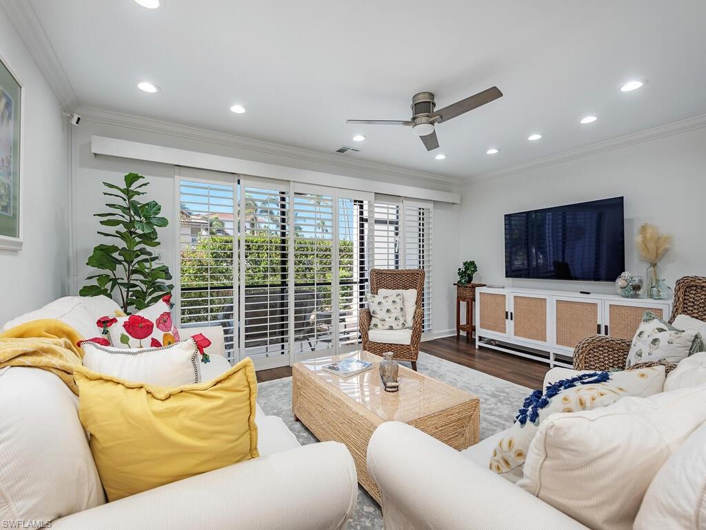 a living room with furniture or window and a flat screen tv