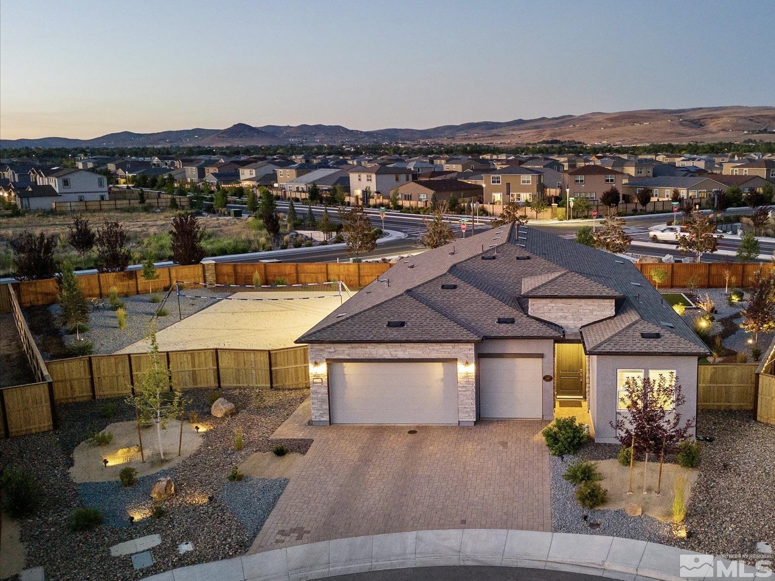 an aerial view of a house with a swimming pool