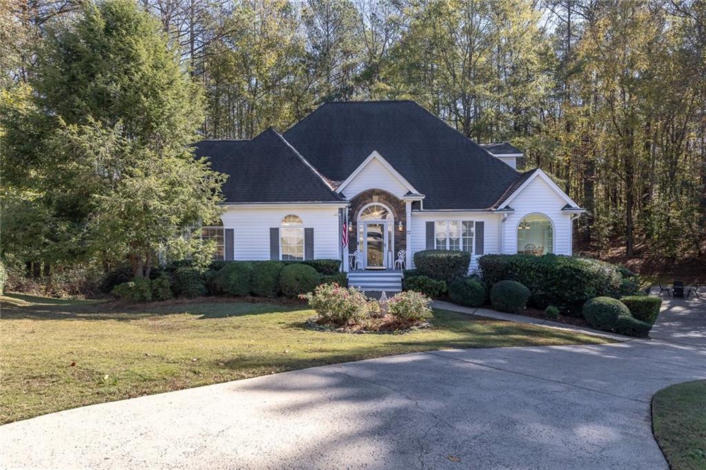 a front view of a house with a yard