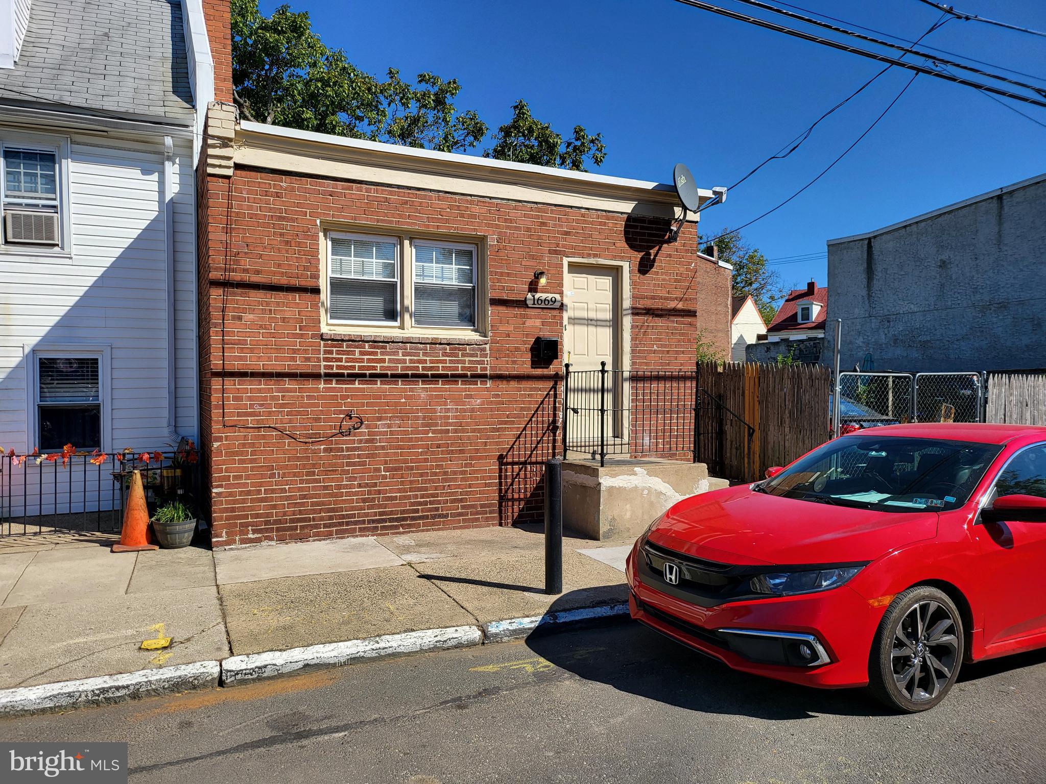 a front view of a house with parking